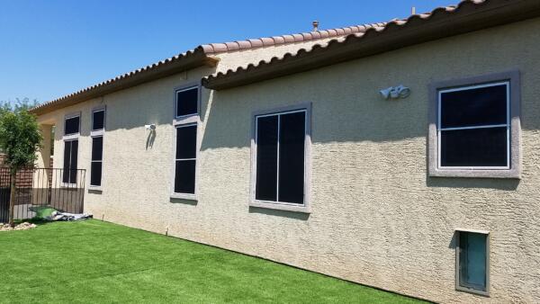 Black solar screens-Elegant touch.  This will keep the artifical grass from burning during the hot Summer months in Las Vegas. 