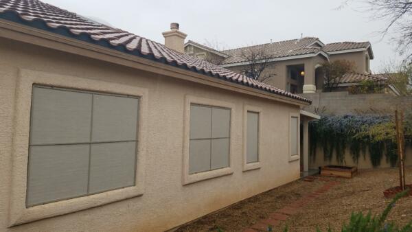 Monochomatic solar screens for contemporary look in Centennial Hills.