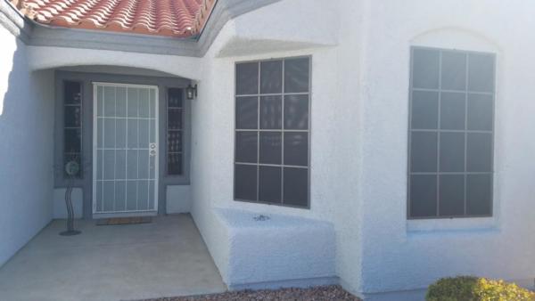 Solar screens with grid pattern coordinate with the front door.