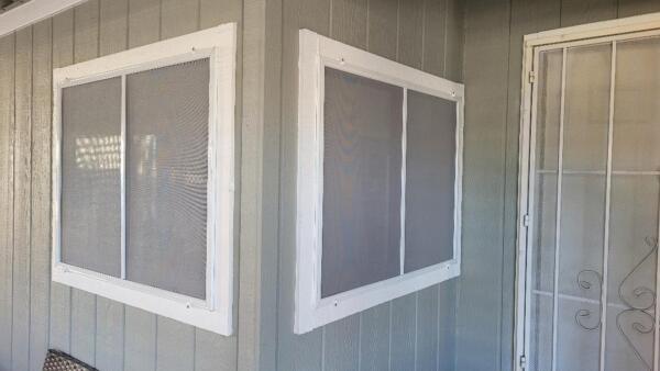 Gray 80% sunscreens with a white frame.  North L.V. 